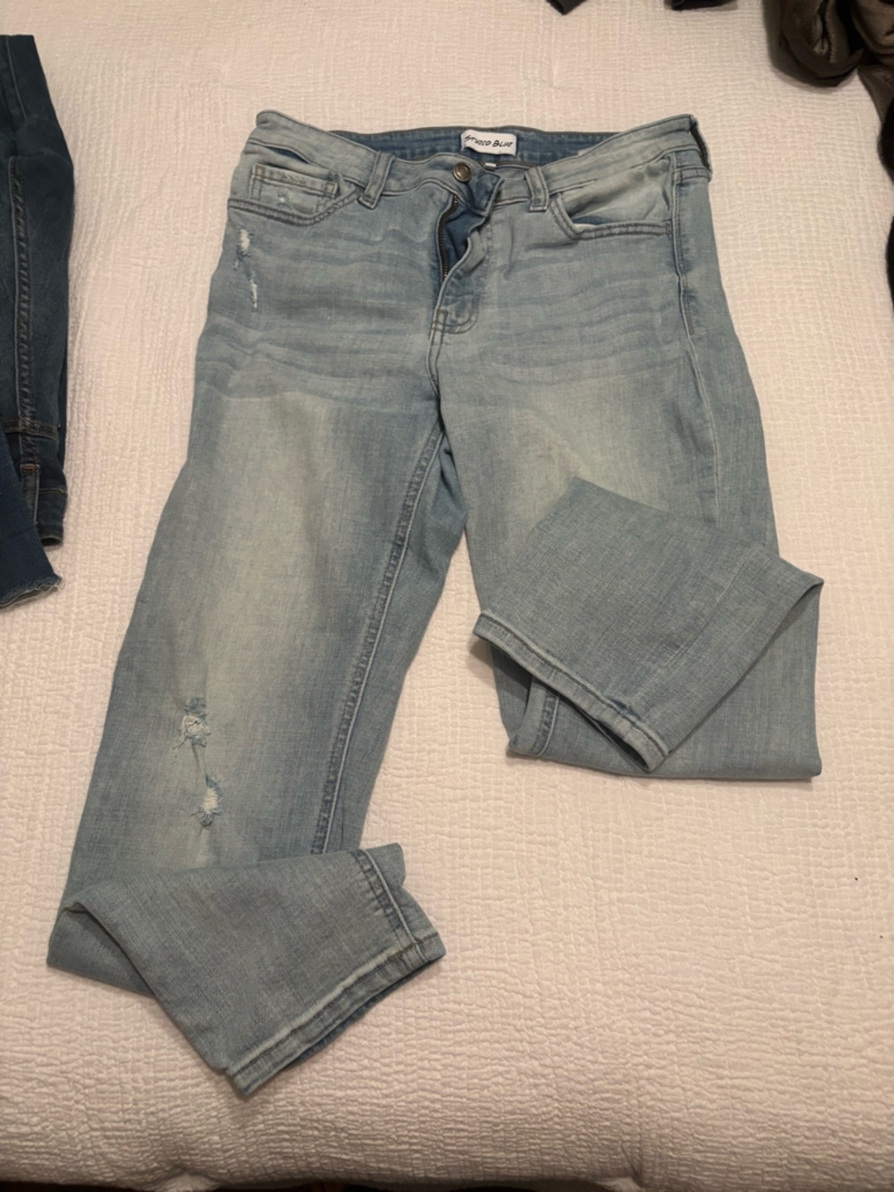 Light Wash Skinny Jeans with Subtle Distressing - Women's